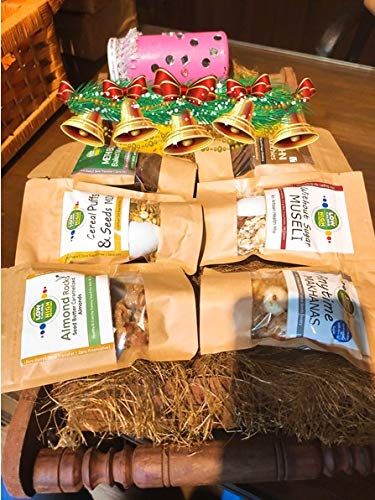 VegOChef Rakhi Health Hamper containing Omega 3 & Fiber Bar (45gms), Cocoa Almond Bar (45gms), Oats & Almonds (45gms), Wholesome Nut & Fruit Bar (45gms), High Protein Bar (50gms), Spicy Chaat (Nuts & Seeds) (60gms), Cereal Puff & Seeds Mix (40gms), W