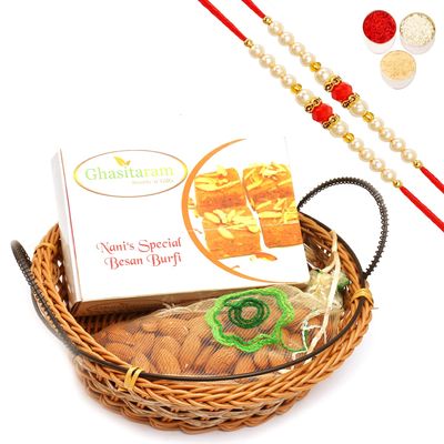 Ghasitaram Gifts Rakhi Gifts/ Rakhi Sweets - Small Cane Basket with Nani's Spl Besan Barfi and Almonds Pouch with 2 Pearl Beads Rakhis