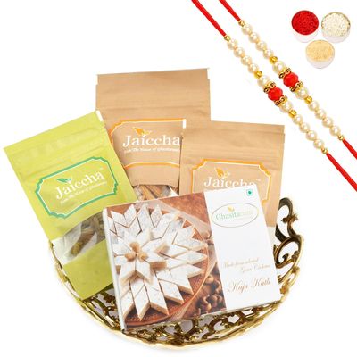 Ghasitaram Gifts Rakhi Gifts/ Rakhi Sweets - Gold Carved Basket of Almonds, Raisins, Butter Chakli and Kaju Katlis with 2 Pearl Beads Rakhis