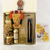 Angroos Kerala Onam wishes and hamper contains banana chips 75g, jaggery chips 75g, parker classic gold, Ferraro Rocher 3 pieces, kathakali sticker, handcraft nettipattam and Kerala Onam greeting card view 3