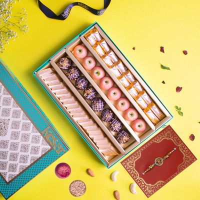 Dessert Drama Premium Gifted Sweet/Mithai Box Assorted Kaju Katli Sweets, Chocolate Ice Ball, Kaju Apple, and Kaju Kesar Roll Sweets Box 900gm Sweet Box With Rakhi For Brother