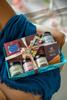 DESEO Premium Gift Hamper with Dark Chocolate, bar,granola, dragees, gourmet dried pomelo & Fox Nuts in Decorative Tray view 1