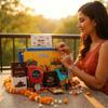 TRUEGANIC Rakhi Gift Combo Box for Brother Bhaiya & Bhabhi-9 Inclusions + Evil Eye Rakhi Nazar Kavach|Chocolate,Millet Namkeen,Almond Bar,Incense Sticks & Stand,Perfume,Coin,Card,Roli Chawall view 2