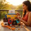 NU LIVING Rakhi Gift Combo Box for Brother Bhaiya & Bhabhi-9 Inclusions + Evil Eye Rakhi Nazar Kavach|Chocolate,Millet Namkeen,Almond Bar,Incense Sticks & Stand,Perfume,Coin,Card,Roli Chawall view 3