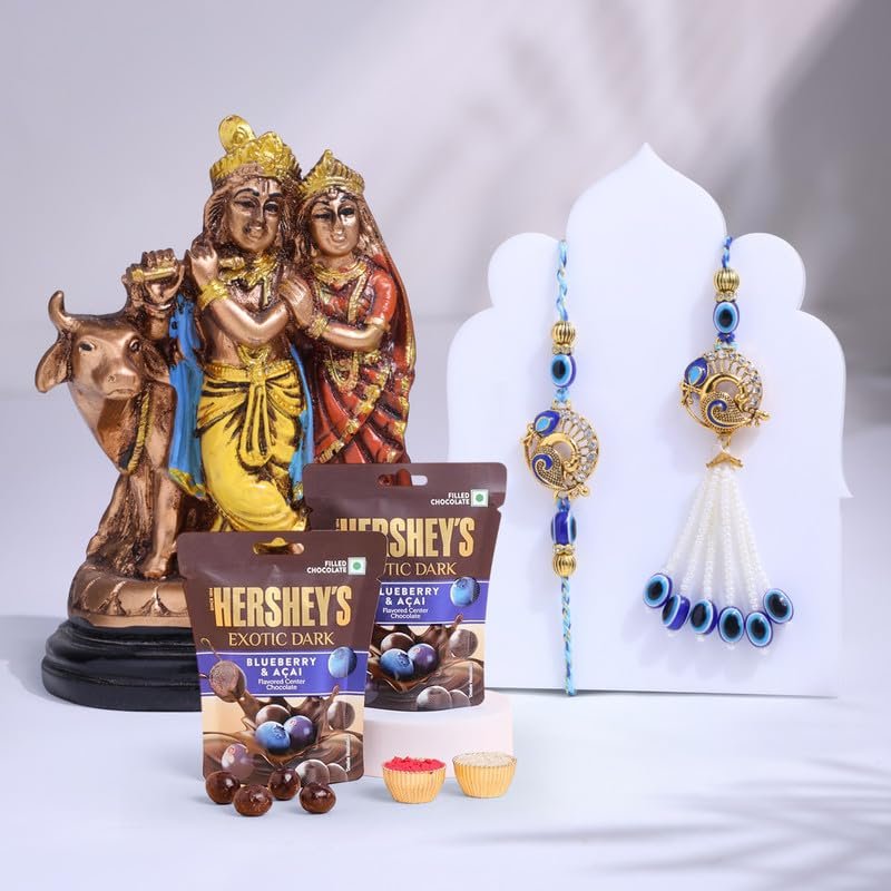 FlowerAura Premium Rakhi For Bhaiya Bhabhi Combo Include Designer Evil Eye Bhaiya Bhabhi Rakhi With Lord Radha Krishna Idol, 2 Chocolate Candy & Roli Chawal Set - Rakhi Gift For Bhaiya Bhabhi & Cousin