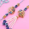 FlowerAura Premium Rakhi For Bhaiya Bhabhi Combo Include Designer Evil Eye Bhaiya Bhabhi Rakhi With Lord Radha Krishna Idol, 2 Chocolate Candy & Roli Chawal Set - Rakhi Gift For Bhaiya Bhabhi & Cousin view 2